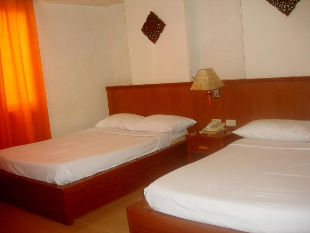 Roxas Midtown Hotel Værelse billede